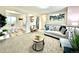 Open living area featuring modern furnishings and decor, seamlessly connecting to the eat-in kitchen at 8820 Cody St, Broomfield, CO 80021
