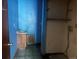 Small bathroom with blue walls, sink and open shelving at 1413 Centennial Dr, Longmont, CO 80501