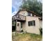 Home exterior with tan siding and second story porch at 1413 Centennial Dr, Longmont, CO 80501