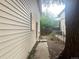 View of the side yard with a fence and overgrown grass at 1413 Centennial Dr, Longmont, CO 80501