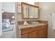 Modern bathroom vanity featuring a glass bowl sink and tile backsplash, adjacent to the bedroom at 1370 S Hudson St, Denver, CO 80222
