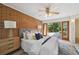 Bright bedroom boasts a brick wall, opens to a patio, and has stylish decor at 1370 S Hudson St, Denver, CO 80222