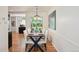 Dining area with modern lighting fixture and table setting overlooking the backyard at 1370 S Hudson St, Denver, CO 80222