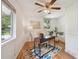 Bright office with hardwood floors, a ceiling fan, and natural light from two windows at 1370 S Hudson St, Denver, CO 80222