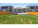 Spacious backyard with well-kept lawn and patio, perfect for outdoor entertaining at 2226 Monte Vista St, Fort Lupton, CO 80621