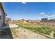 Spacious backyard with grass, a wooden fence, and a concrete patio at 2226 Monte Vista St, Fort Lupton, CO 80621