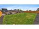 Expansive, grassy backyard enclosed by a wooden fence, offering privacy and space at 2226 Monte Vista St, Fort Lupton, CO 80621