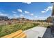 Large backyard with a new wooden fence, grass, and concrete patio at 2226 Monte Vista St, Fort Lupton, CO 80621