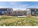 A spacious backyard features a lawn, patio, and wood fencing at 2226 Monte Vista St, Fort Lupton, CO 80621