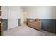 Bedroom with closet, dresser and gray wainscoting detail at 2226 Monte Vista St, Fort Lupton, CO 80621