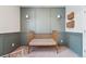 Cozy Bedroom with decorative gray trim, sconces, and gold-toned crib at 2226 Monte Vista St, Fort Lupton, CO 80621