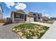 Beautiful home featuring a covered porch and a lush front yard, perfect for Gathering living at 2226 Monte Vista St, Fort Lupton, CO 80621