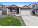 Charming home with a well-maintained front yard and a two-car garage, plus a cozy porch at 2226 Monte Vista St, Fort Lupton, CO 80621