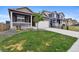 Inviting home with landscaped front yard, porch, and driveway, showcasing curb appeal at 2226 Monte Vista St, Fort Lupton, CO 80621
