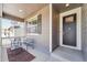 Cozy front porch with seating, offering a charming view and a welcoming entrance to the home at 2226 Monte Vista St, Fort Lupton, CO 80621
