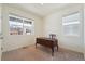 Bright home office featuring two windows and a vintage desk at 2226 Monte Vista St, Fort Lupton, CO 80621