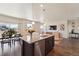 Kitchen island with granite countertop, stainless steel appliances and views into the living area at 2226 Monte Vista St, Fort Lupton, CO 80621