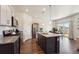 Modern kitchen featuring granite countertops, stainless steel appliances, and an island with seating at 2226 Monte Vista St, Fort Lupton, CO 80621