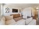 Cozy living room with neutral tones, plush seating, and ample natural light at 2226 Monte Vista St, Fort Lupton, CO 80621