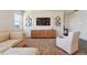 Tastefully decorated living room with a modern entertainment center and comfortable seating at 2226 Monte Vista St, Fort Lupton, CO 80621