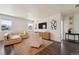 Bright living room featuring stylish decor, a comfortable sofa, and decorative wall art at 2226 Monte Vista St, Fort Lupton, CO 80621