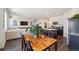 Open-concept living space with dining area, modern kitchen, and inviting living room at 2226 Monte Vista St, Fort Lupton, CO 80621