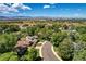 Aerial view of a home surrounded by lush trees and landscaping in a residential neighborhood at 5050 W 102 Ave, Westminster, CO 80031