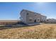 Backyard featuring a large lawn and fenced perimeter at 579 Jewel St, Brighton, CO 80603