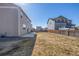 Spacious fenced backyard with a concrete patio, perfect for outdoor entertaining and relaxation at 579 Jewel St, Brighton, CO 80603