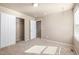 Carpeted bedroom featuring 2 closets and natural light from a window at 579 Jewel St, Brighton, CO 80603