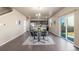 Stylish dining area with modern chairs, a view of the kitchen, and access to the outdoor area at 579 Jewel St, Brighton, CO 80603