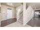 Welcoming foyer with hardwood floors, a staircase, and direct access to the living areas at 579 Jewel St, Brighton, CO 80603