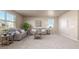 Bright and airy living room with neutral tones, plush carpeting, and plenty of natural light at 579 Jewel St, Brighton, CO 80603