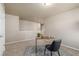 Upstairs office space featuring neutral tones, a stylish desk and chair, and plush carpeting at 579 Jewel St, Brighton, CO 80603