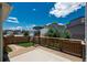A charming back deck with partial fencing features beautiful neighborhood views and landscaped yard at 9781 Dunning Cir, Highlands Ranch, CO 80129