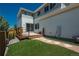 Backyard with a wooden deck, artificial turf, and stone pathway at 9781 Dunning Cir, Highlands Ranch, CO 80129