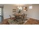Elegant dining room with stylish furniture, wood floors, and modern lighting, perfect for entertaining at 9781 Dunning Cir, Highlands Ranch, CO 80129