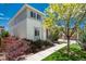 Charming two-story home with well-manicured lawn and landscaping, sidewalk, and driveway at 9781 Dunning Cir, Highlands Ranch, CO 80129