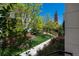Sidewalk near community garden with lush landscaping at 9781 Dunning Cir, Highlands Ranch, CO 80129