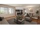 Inviting living room with plenty of natural light, wood floors, and modern decor at 9781 Dunning Cir, Highlands Ranch, CO 80129