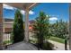 Covered front porch with a view of the trees at 9781 Dunning Cir, Highlands Ranch, CO 80129