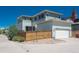 Home featuring a fenced backyard, garage, and private patio area, perfect for outdoor living at 9781 Dunning Cir, Highlands Ranch, CO 80129