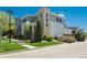 Well-maintained home with a side yard, grassy area, and mature trees enhancing its curb appeal at 9781 Dunning Cir, Highlands Ranch, CO 80129