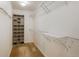 Spacious walk-in closet featuring custom shelving and a built-in organizer for optimal storage solutions at 9781 Dunning Cir, Highlands Ranch, CO 80129