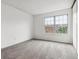 Bright, carpeted bedroom with a large window offering natural light and a peaceful atmosphere at 1699 S Trenton St # 174, Denver, CO 80231