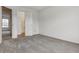 Spacious carpeted bedroom featuring an open doorway to a bathroom with neutral walls and a comfortable layout at 1699 S Trenton St # 174, Denver, CO 80231