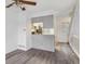 Comfortable living area with hardwood floors, a nearby kitchen and a staircase for easy access to other levels at 1699 S Trenton St # 174, Denver, CO 80231