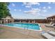 Sparkling swimming pool surrounded by comfortable lounge chairs, promising relaxation and summer fun at 1699 S Trenton St # 174, Denver, CO 80231
