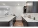 Basement wet bar features built-in cabinets, wine fridge, and under-counter lighting at 11383 Autumn Moon St, Littleton, CO 80125