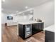 Finished basement includes wet bar, built-in cabinets, and a beverage fridge at 11383 Autumn Moon St, Littleton, CO 80125
